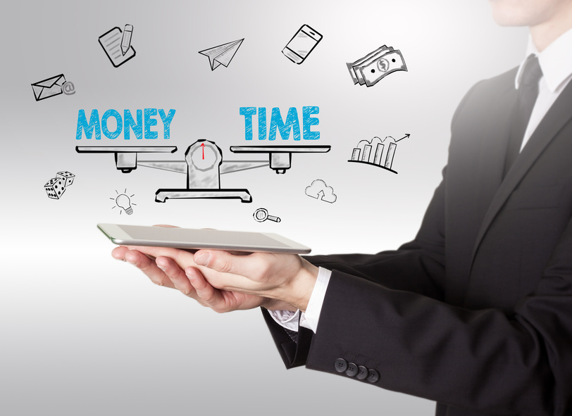 Money and Time Balance, young man holding a tablet computer